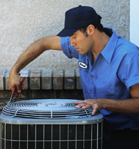 technician-servicing-air-conditioner