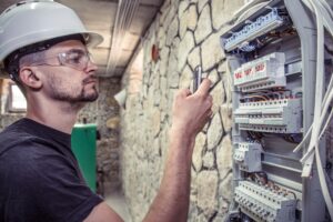tech-working-on-electric-panel